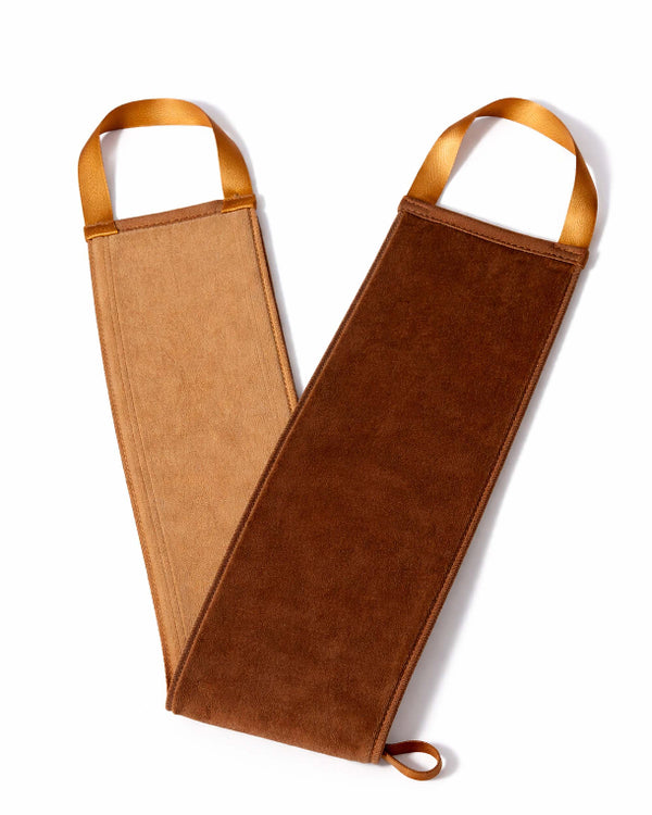 Brown leather bottle holder with tan handles on a white background