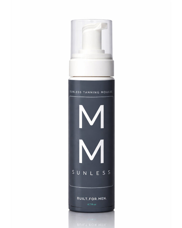 Sunless tanning mousse bottle with 'MM' branding on a white for men self tanning