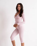 Woman wearing SoftSculpt Everyday Capri Legging in Petal Pink | MAKAI