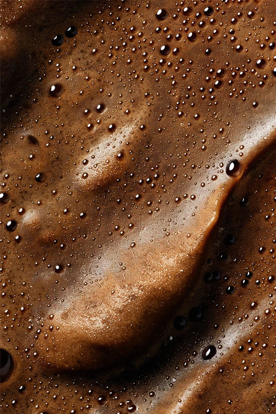 dark self tanning mousse macro shot