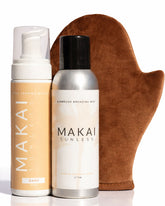 Two bottles of Makai sunless tanning products and a brown mitt on a white background