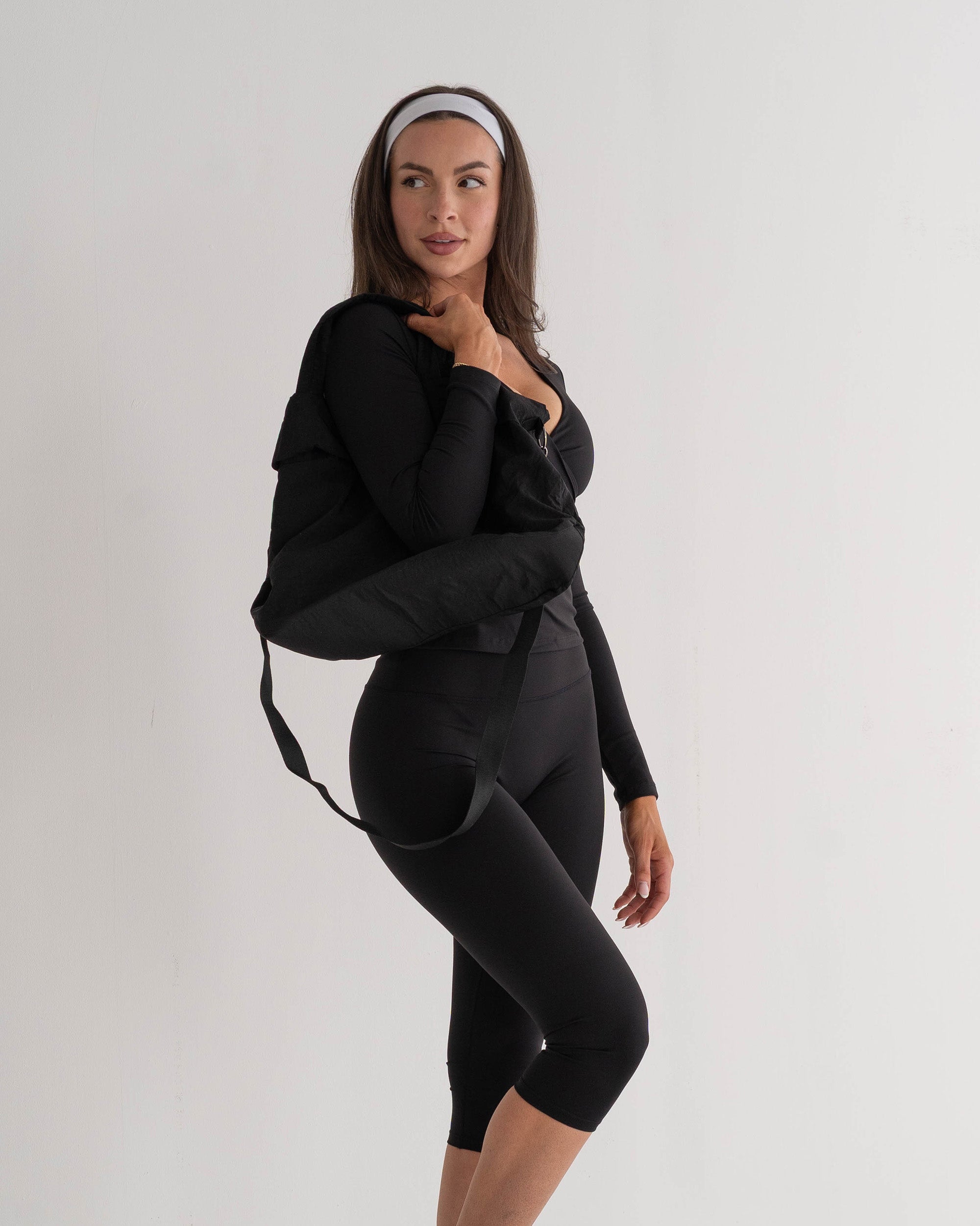 Woman wearing SoftSculpt Everyday Capri Legging in Black | MAKAI