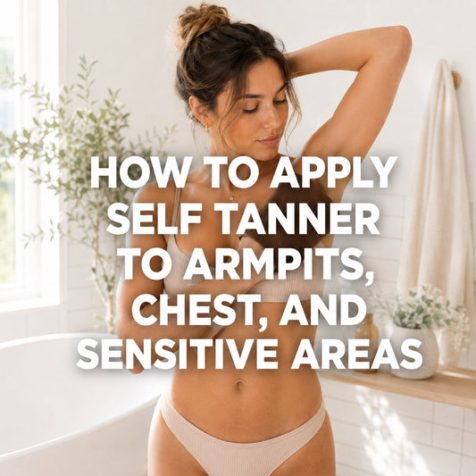 Woman applying self-tanner to her underarm and chest in a bright, neutral bathroom.