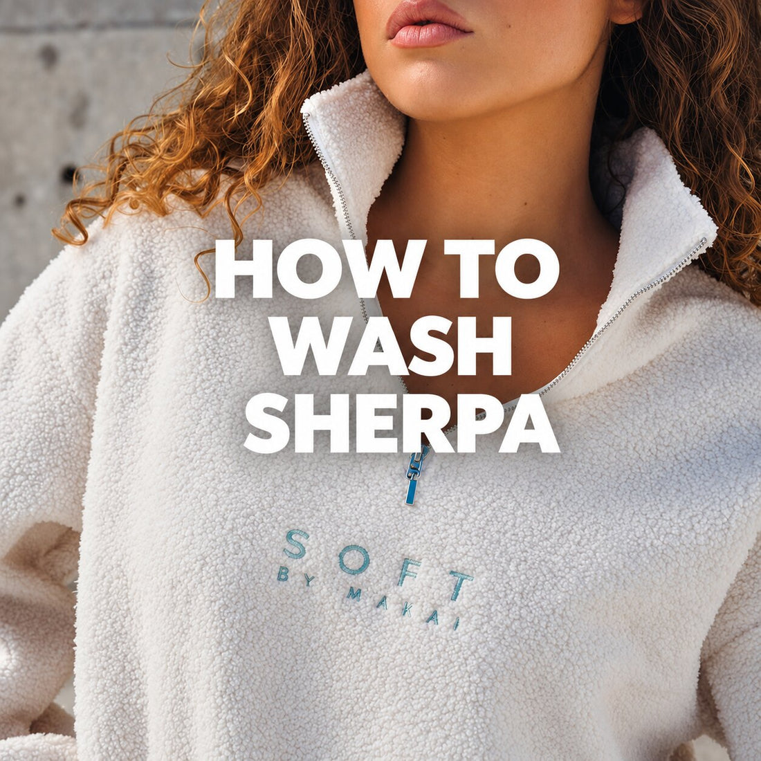 Woman wearing a white sherpa quarter-zip pullover with text reading "How to Wash Sherpa."