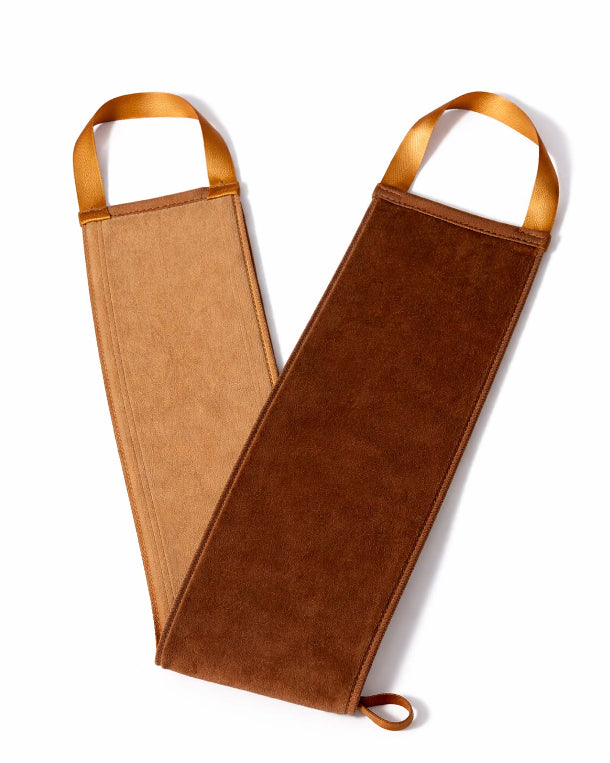 Brown leather bottle holder with tan handles on a white background