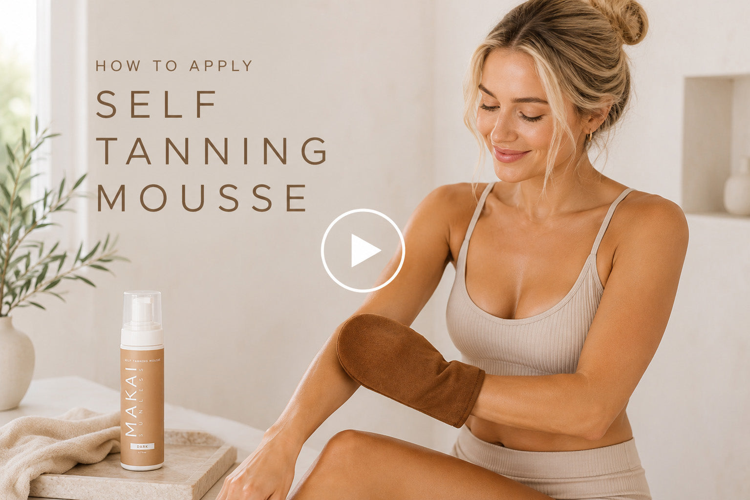 a woman showing how to apply self tanning mousse