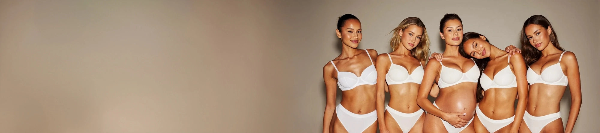 Five women wearing white and pregnancy safe self tanner against a neutral background
